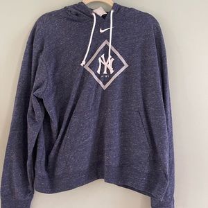 Brand new. Was originally $75. Yankees light hooded sweatshirt. tags on.